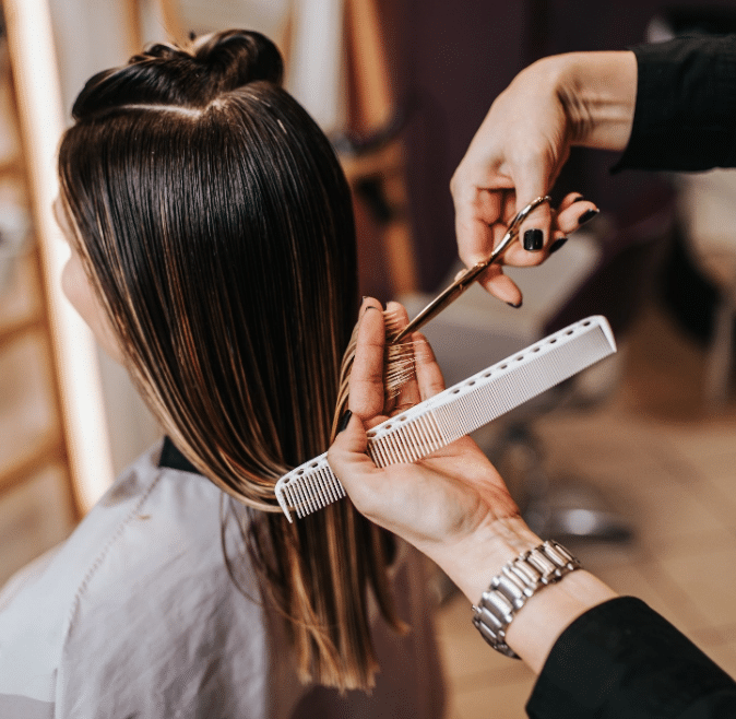 Womans Hair Being Cut and Styled